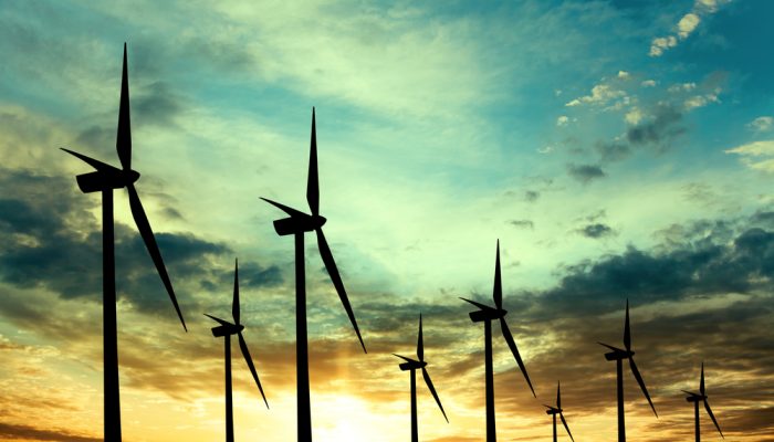 Wind turbines farm at sunset